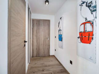 Step into this inviting hallway, showcasing a blend of modern design and natural elements.
