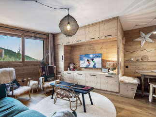 This cozy living space features a stunning wooden interior, creating a warm and inviting atmosphere.
