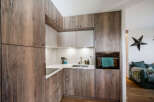 This stunning kitchen boasts custom wood cabinetry, offering both style and ample storage space.
