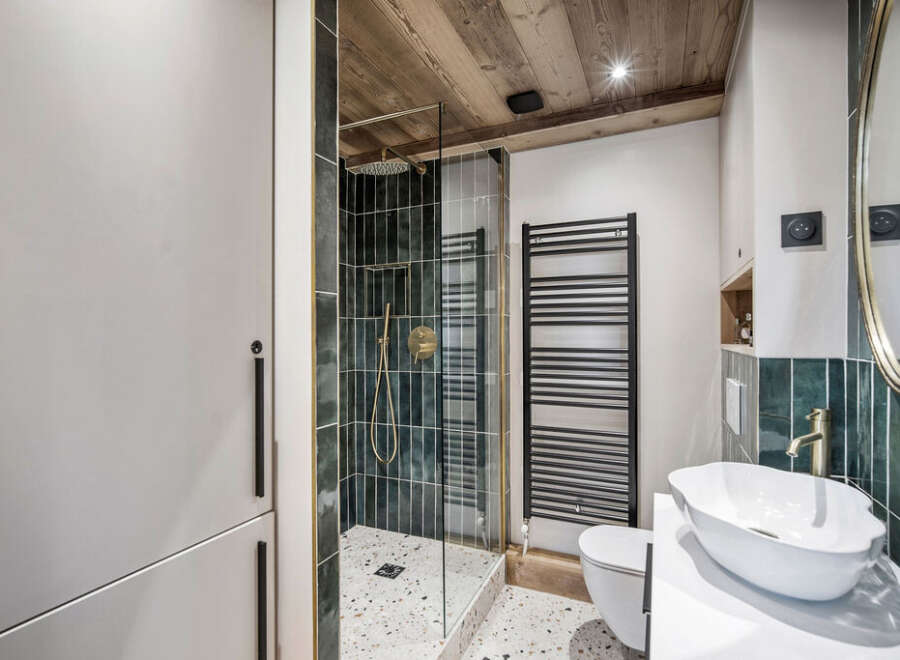 Step into luxury with this stunning bathroom featuring a modern shower and elegant fixtures.