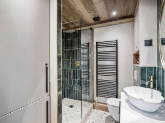 Step into luxury with this stunning bathroom featuring a modern shower and elegant fixtures.