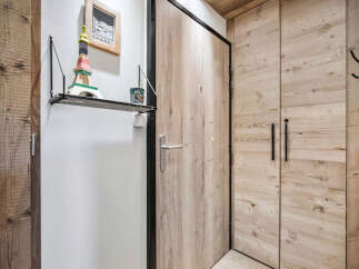 Step into a world of rustic charm with this inviting entryway.