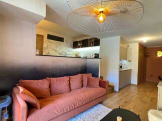 This stunning property boasts a modern living space with a unique design.