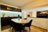 Discover modern living in this stylish property, featuring a beautifully designed dining area.