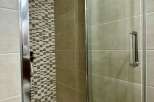 Step into a modern bathroom oasis with this stunning shower enclosure.