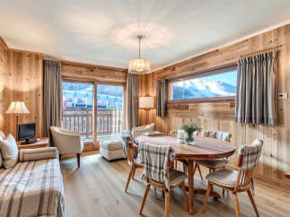 Experience the charm of this stunning property, featuring a warm and inviting interior with wood paneling throughout.