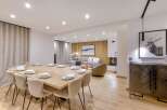 Experience luxury living in this stunning property, featuring a spacious dining area perfect for entertaining.