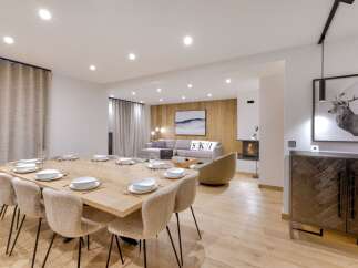Experience luxury living in this stunning property, featuring a spacious dining area perfect for entertaining.