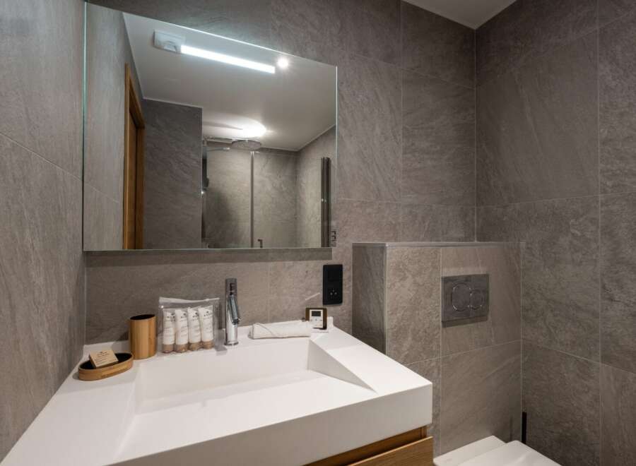 This modern bathroom boasts sleek design and functionality.