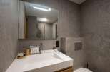 This modern bathroom boasts sleek design and functionality.