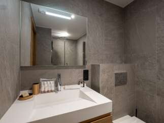 This modern bathroom boasts sleek design and functionality.
