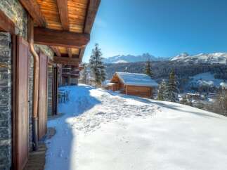 Experience the ultimate winter escape in this stunning chalet nestled in the heart of the mountains.