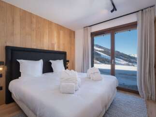 Experience luxury and breathtaking views in this stunning bedroom.