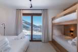 Experience the ultimate ski chalet retreat in this stunning bedroom.