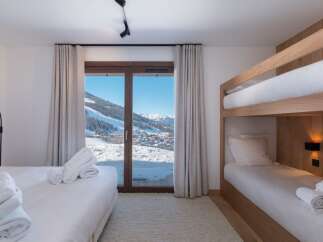 Experience the ultimate ski chalet retreat in this stunning bedroom.