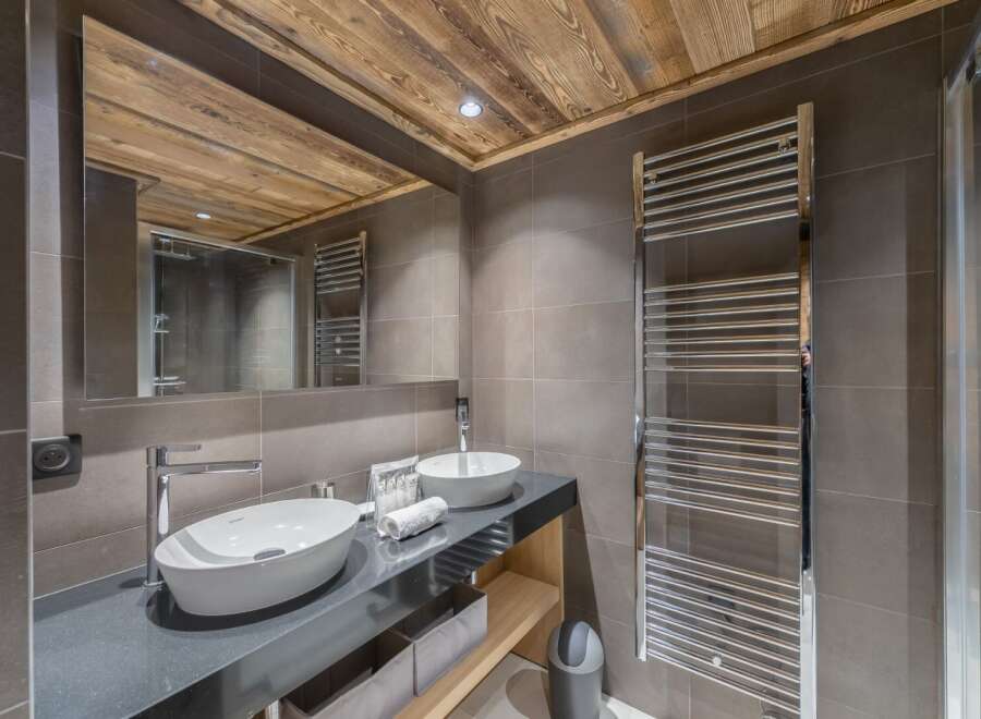 Discover luxury living in this stunning property featuring a modern bathroom.