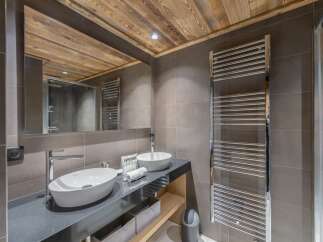 Discover luxury living in this stunning property featuring a modern bathroom.