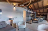 Experience luxury living in this stunning property featuring a cozy fireplace, perfect for chilly evenings.