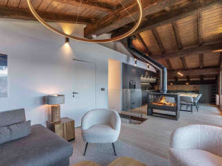 Experience luxury living in this stunning property featuring a cozy fireplace, perfect for chilly evenings.