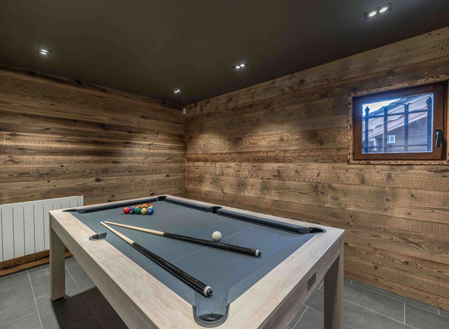This stunning property boasts a luxurious game room, perfect for entertaining guests or enjoying a relaxing evening.