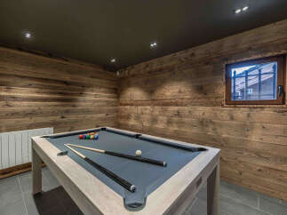 This stunning property boasts a luxurious game room, perfect for entertaining guests or enjoying a relaxing evening.