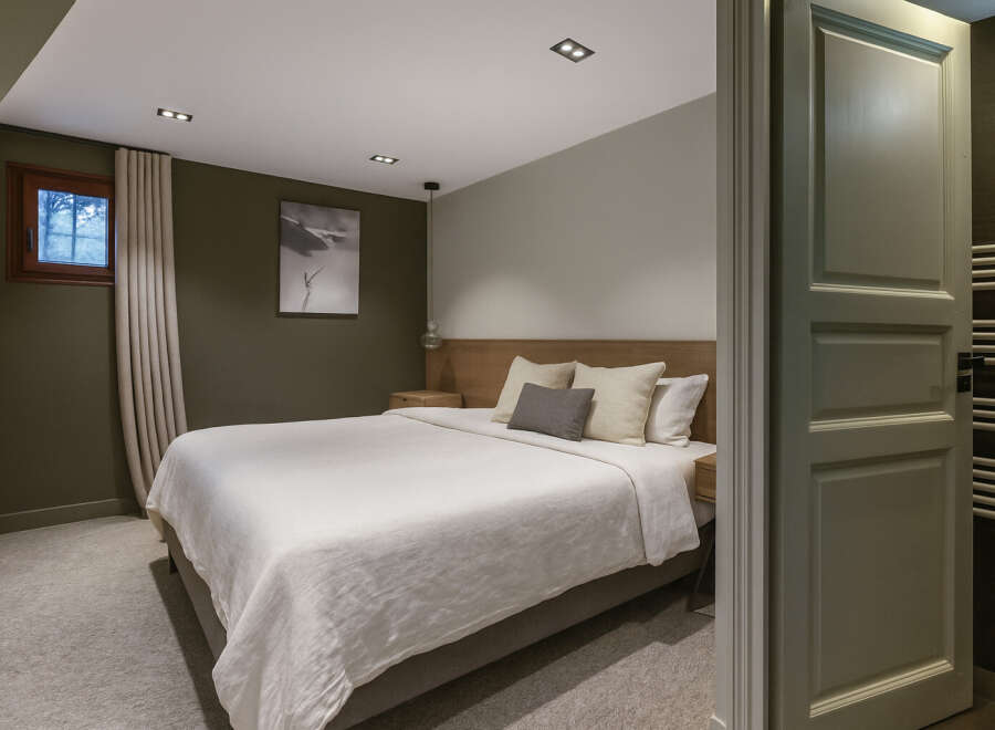 Step into this inviting bedroom, featuring a serene ambiance and modern design.