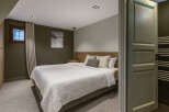 Step into this inviting bedroom, featuring a serene ambiance and modern design.
