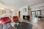 Experience luxury living in this stunning property featuring a cozy fireplace, perfect for relaxing evenings.