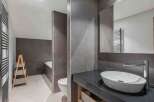 This modern bathroom boasts sleek design and functionality.