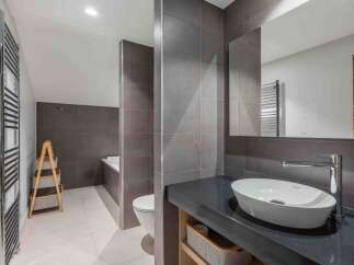 This modern bathroom boasts sleek design and functionality.