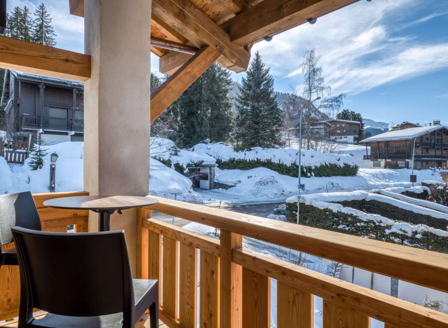 Enjoy breathtaking mountain views from this charming balcony.