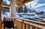 Enjoy breathtaking mountain views from this charming balcony.