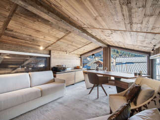 Experience the epitome of rustic luxury in this stunning property, featuring a beautifully designed interior with exposed wooden beams and a cozy ambiance.