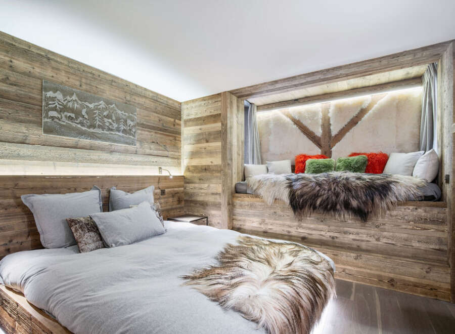 Experience rustic luxury in this stunning bedroom.