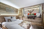 Experience rustic luxury in this stunning bedroom.