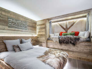 Experience rustic luxury in this stunning bedroom.