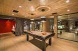 This luxurious game room features a stunning pool table, perfect for entertaining guests.