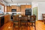 This stunning kitchen boasts beautiful wooden cabinetry and a spacious layout, perfect for both cooking and entertaining.