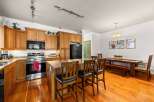 This stunning kitchen boasts beautiful wooden cabinetry and a spacious layout, perfect for both cooking and entertaining.