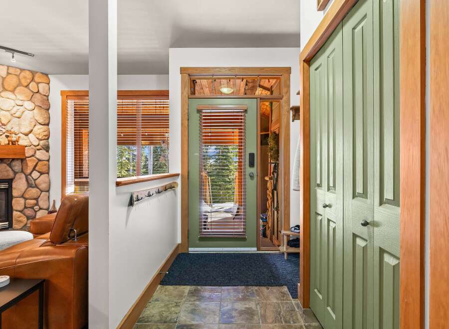 Step into this inviting entryway, showcasing a blend of rustic charm and modern design.