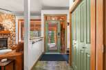 Step into this inviting entryway, showcasing a blend of rustic charm and modern design.