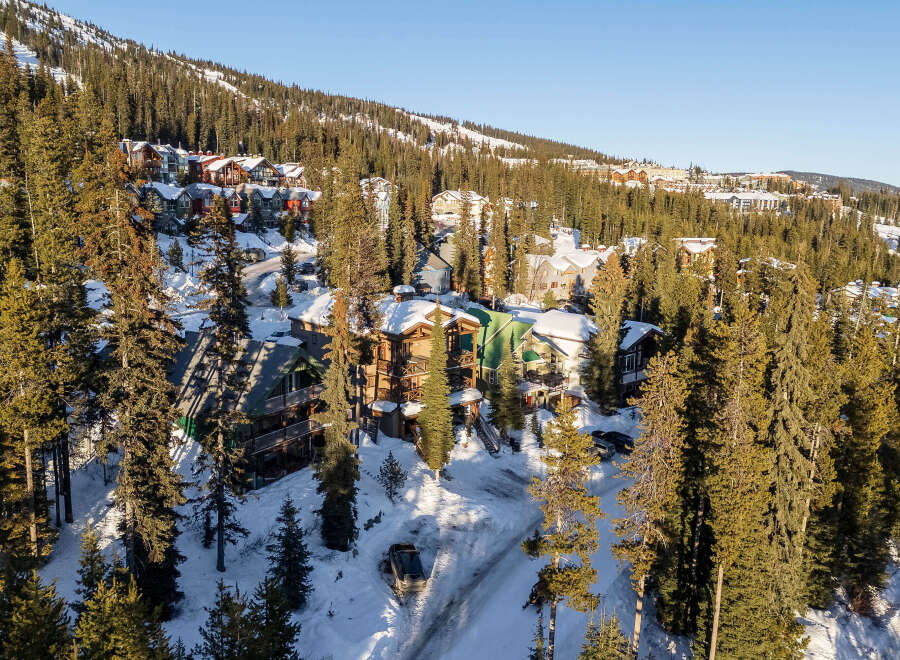Nestled amidst a snowy landscape, this stunning property offers a serene escape.