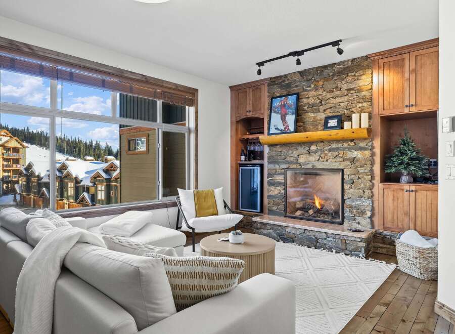 Experience luxury living in this stunning property featuring a cozy fireplace and a breathtaking view.