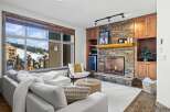 Experience luxury living in this stunning property featuring a cozy fireplace and a breathtaking view.