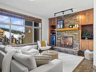 Experience luxury living in this stunning property featuring a cozy fireplace and a breathtaking view.