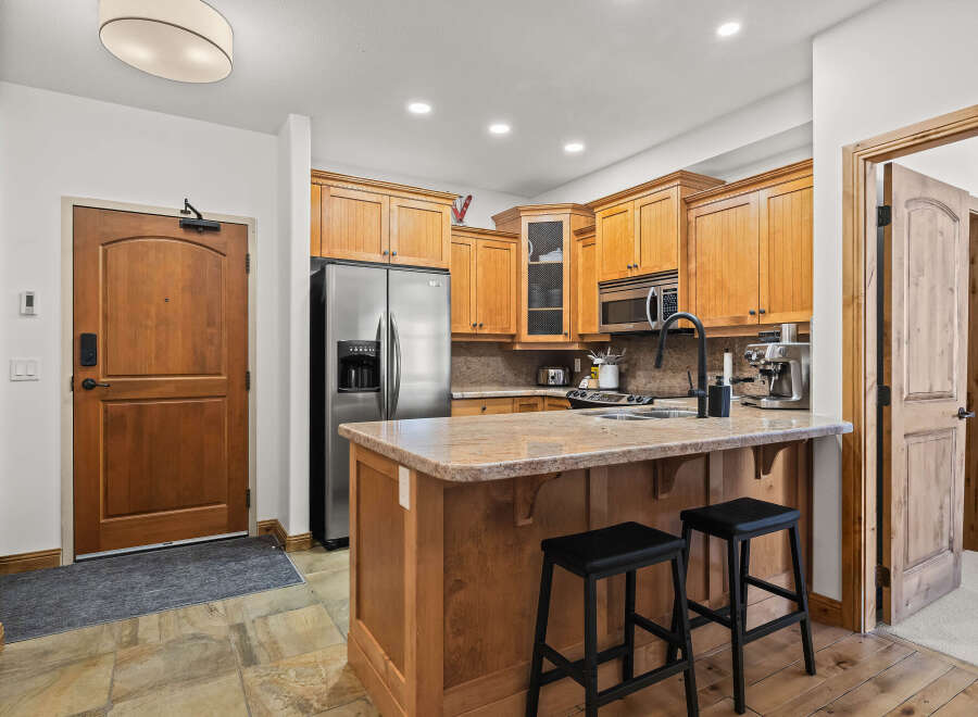 This stunning kitchen boasts a modern design with stainless steel appliances and ample cabinet space.