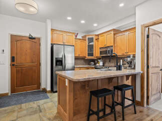 This stunning kitchen boasts a modern design with stainless steel appliances and ample cabinet space.
