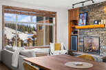 Experience luxury living in this stunning property featuring a cozy fireplace and a modern wine cooler.