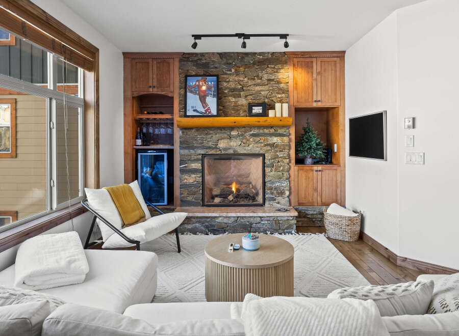 Experience luxury living in this stunning property featuring a cozy fireplace, perfect for chilly evenings.