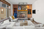Experience luxury living in this stunning property featuring a cozy fireplace, perfect for chilly evenings.